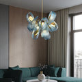 A stylish modern living room highlighted by a prominent blue chandelier, enhancing the room's ambiance.