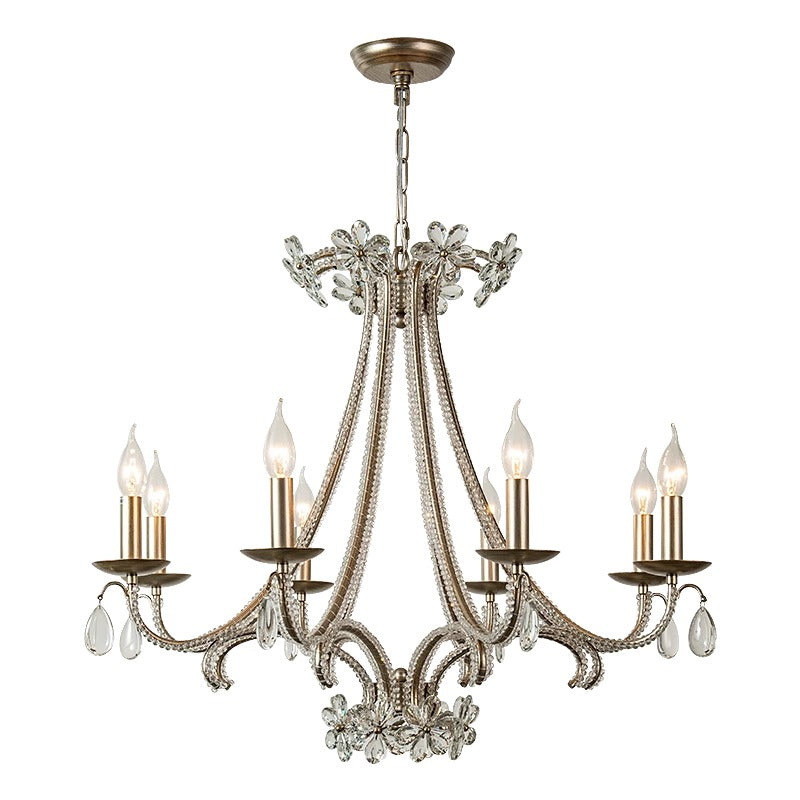 A stylish chandelier with five lights and crystal details, providing a touch of luxury and brightness to the environment.