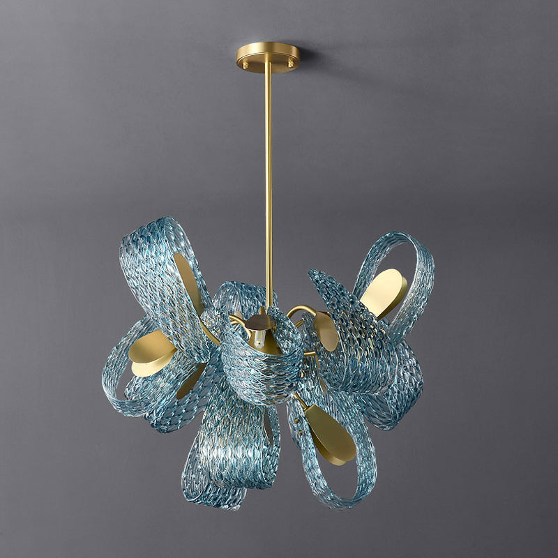 A contemporary living room featuring a large blue chandelier that adds elegance to the space.