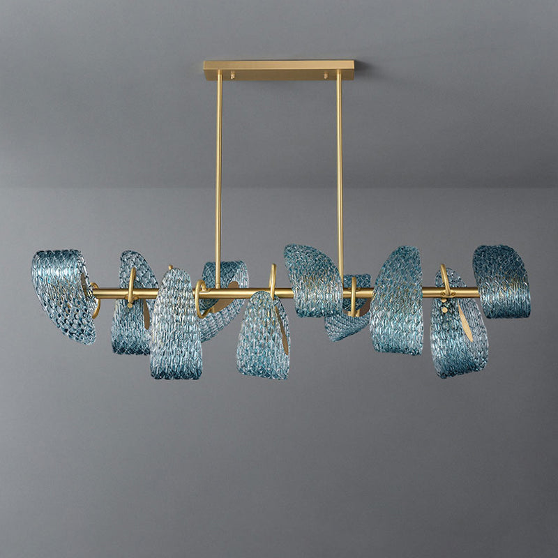 A modern chandelier featuring a brass lamp body with an elegant gold finish and multiple handmade peacock blue glass lampshades. The artistic design creates a dynamic and luxurious appearance, perfect for dining rooms, adding a touch of sophistication and warmth to the space.