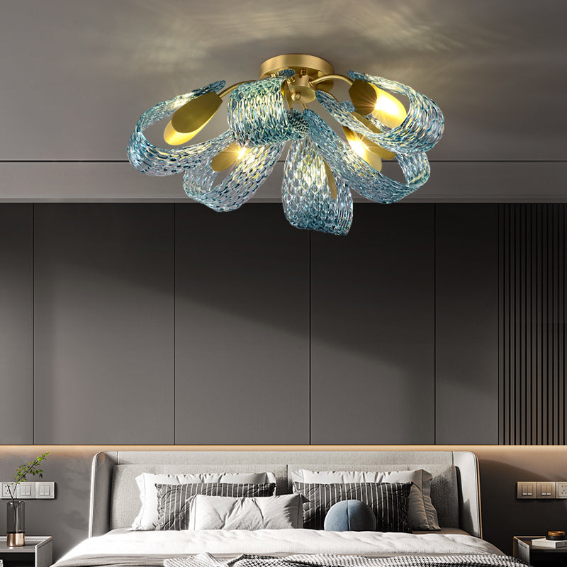 A contemporary bedroom featuring a stylish blue chandelier that enhances the modern decor and ambiance of the space.