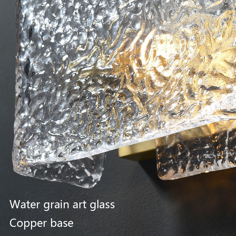 Textured glass with water-like pattern on a copper base, illuminated to showcase details.