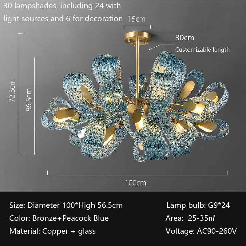 A glass sculpture featuring an elegant design topped with a striking gold ring, showcasing artistry and sophistication.