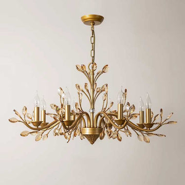 A luxurious chandelier featuring gold leaf branches adorned with sparkling crystals, illuminating the space with elegance.