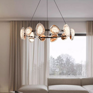 Modern round chandelier with premium metal frame and acrylic lampshades, featuring multiple crystal-textured light heads and adjustable hanging wires, ideal for living rooms, dining areas, and hotels.