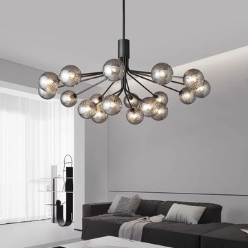 Modern spherical chandelier above a sleek living room setting.