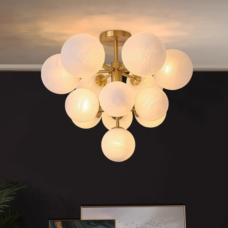 Combining simplicity and luxury, the glass globes harmonize beautifully with the brass frame, adding warmth and elegance to your space.