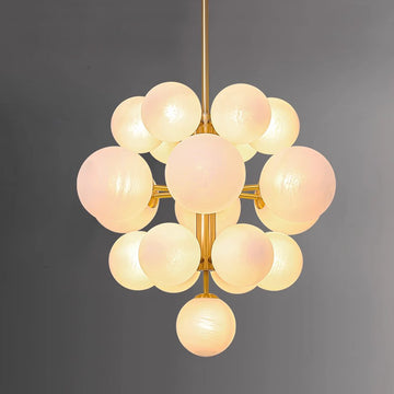 Combining simplicity and luxury, the glass globes harmonize beautifully with the brass frame, adding warmth and elegance to your space.