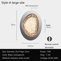 The wall lamps for bedroom are modern oval-shaped acrylic lights, 33 cm high and 24.5 cm wide, featuring a sleek black and transparent design. They are energy-efficient LED lights with dimming at 15W for areas of 1-3㎡, offer smart dimming via remote control, and require AC90-260V.