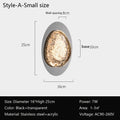 This modern acrylic wall lamp, ideal for spaces of 1-3㎡, has an oval design with a gold-textured interior and a black-transparent exterior. Featuring energy-efficient LED technology and smart dimming. Dimensions: H25 cm, base 10 cm, diameter 16 cm; voltage: AC90-260V. Product: bedroom wall lamps.