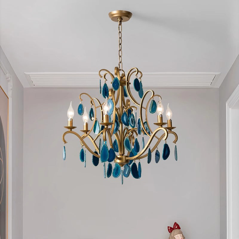 A blue chandelier elegantly suspended from the ceiling, illuminating the room with its vibrant color and design.