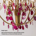 A stunning chandelier adorned with pink stones, elegantly suspended from the ceiling, illuminating the space below.