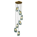 A modern chandelier with multiple hanging lights encased in textured blue shells.