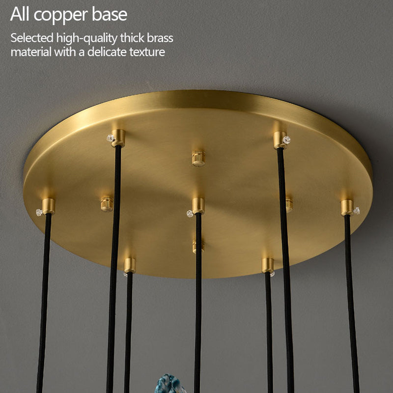 Brass ceiling base with text "All copper base" and wires hanging for fixture installation.