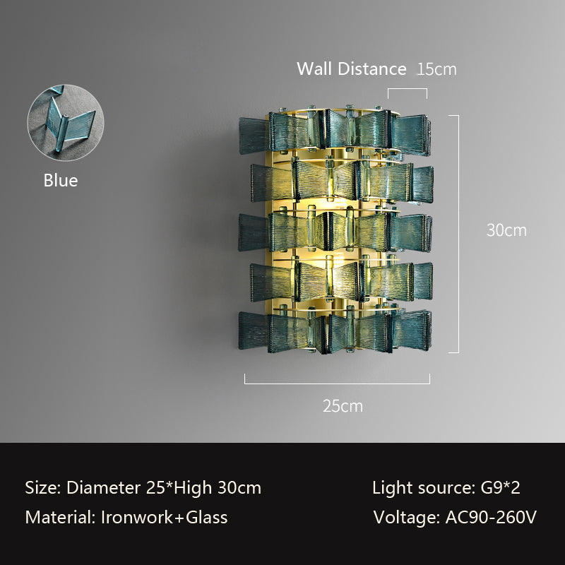This Chandelier Series modern blue wall lamp features intricate ironwork and glass materials, measuring 30cm high and 25cm in diameter. It emits a warm glow against a gray wall using G9 light sources and AC90-260V voltage, resembling a stylish glass pendant light with a 15cm wall distance.