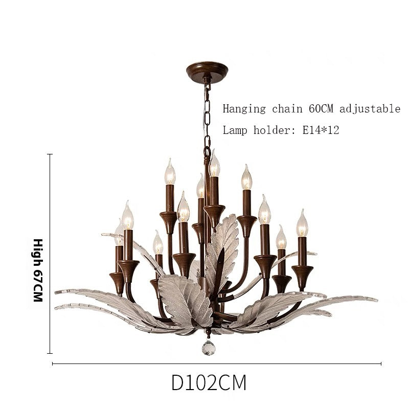 A luxurious multi-tiered chandelier with 12 candle-style bulbs, adorned with glass leaf accents. The chandelier hangs elegantly from a chain, making it a perfect centerpiece for large dining or living spaces.