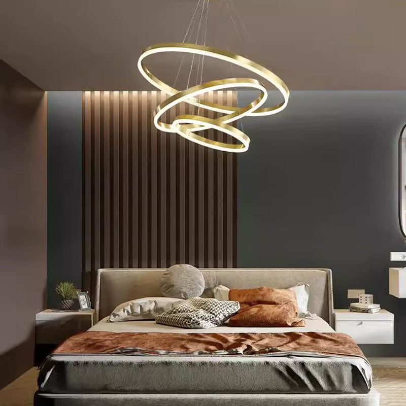 A sleek, modern chandelier with two interlinked rings hanging from the ceiling, adding sophistication to the interior.