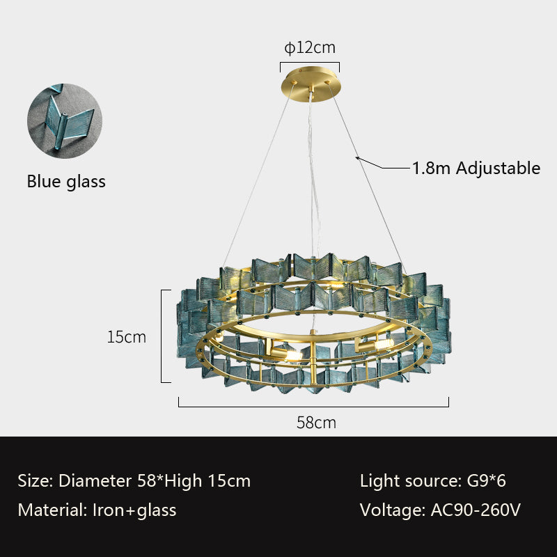 Experience modern lighting with the Chandelier Series: a circular hanging chandelier crafted from blue glass panels and gold fixtures. With a 58cm diameter, 15cm height, and adjustable up to 1.8m, it accommodates 6 G9 bulbs, is made of iron and glass, and supports AC90-260V.