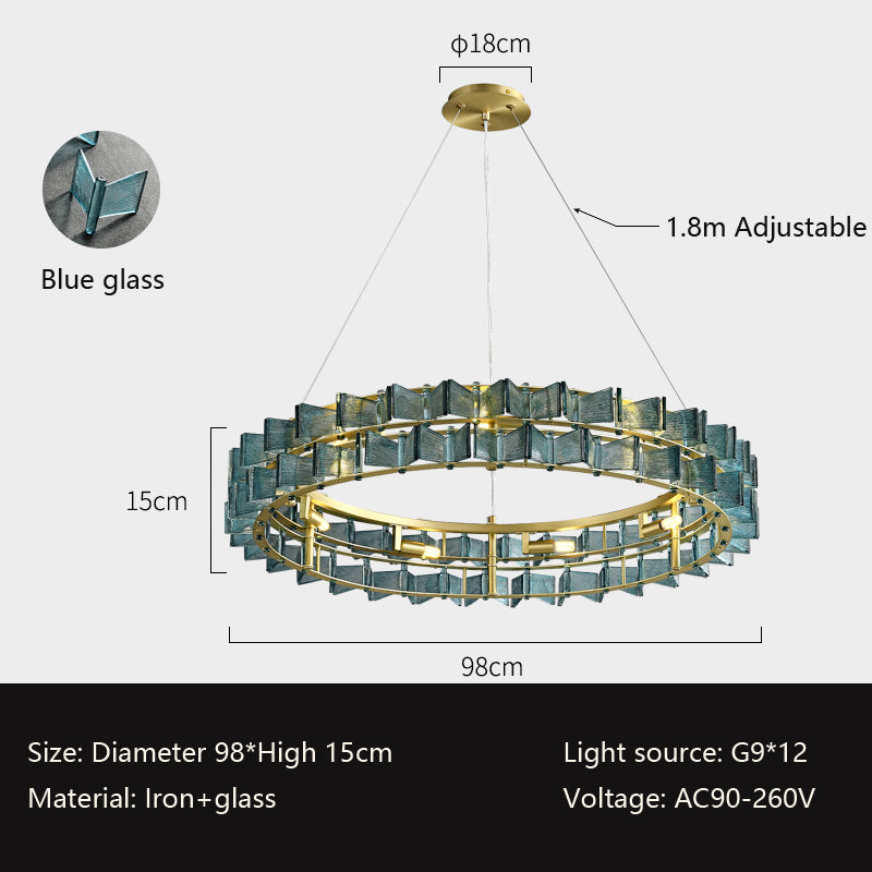 The Chandelier Series is a modern glass pendant light with blue glass panels and a gold frame, measuring 98 cm in diameter and 15 cm high, adjustable to 1.8 m. It utilizes G9 bulbs with an AC90-260V voltage and features iron and glass construction for an elegant touch.