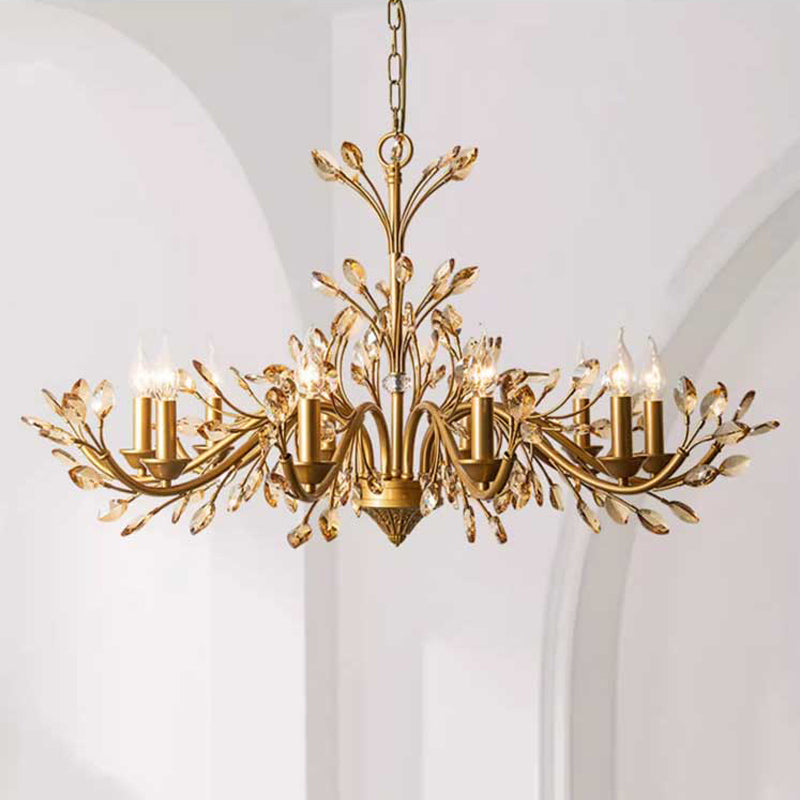 A luxurious chandelier featuring gold leaf branches adorned with sparkling crystals, illuminating the space with elegance.