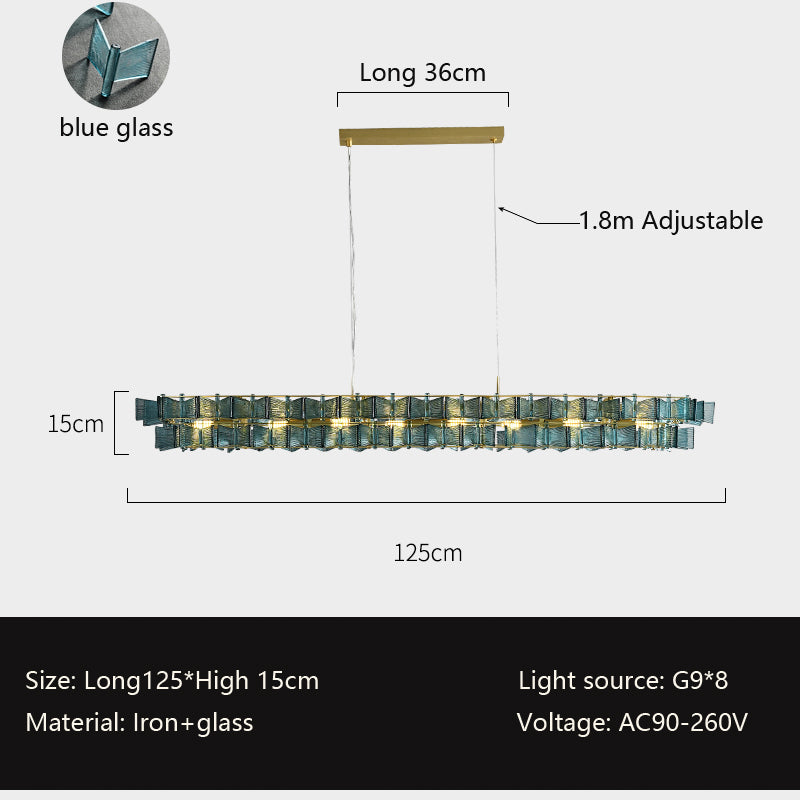 A rectangular pendant light measuring 125cm in length and 15cm in height, with an adjustable hanging wire up to 1.8 meters, ideal for dining tables or kitchen islands. The fixture is designed with a golden metal frame and blue glass blocks, showcasing a modern and elegant style. It comes with 8 dimmable G9 bulbs, supporting a voltage range of AC90-260V, allowing brightness adjustment to meet various needs. Made of iron and glass, it is a perfect choice for high-quality decoration and lighting.
