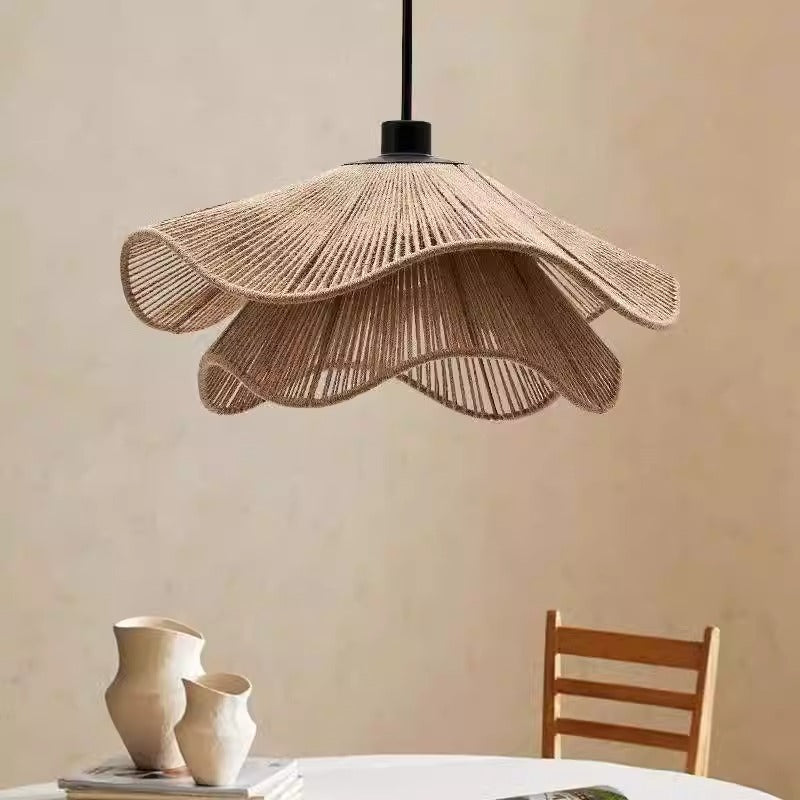 A sleek pendant light with a beautifully woven shade, perfect for enhancing the ambiance of a modern room.