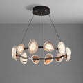 This round chandelier, with a sleek black frame and suspended by four cords, features textured oval-shaped reflective glass elements. Its warm glow enhances any room, while the smart dimming function offers customizable ambiance against a plain gray background.