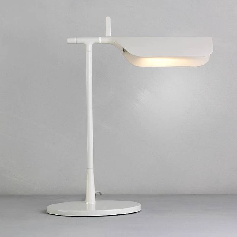 The Simple Desktop Lamp features a modern white design with a horizontal LED fixture, round base, and slim stand. It emits a soft, warm light that creates a subtle glow against a plain gray background.