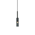 A black and white image depicting a hanging light fixture, showcasing its elegant design and soft illumination.