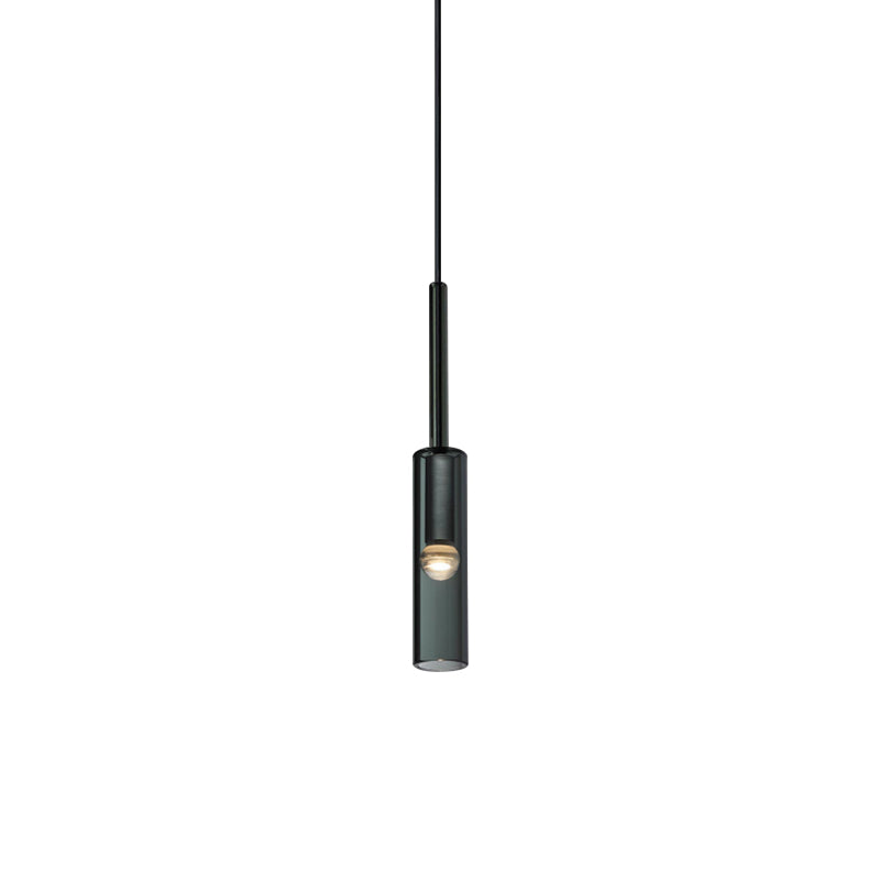 A black and white image depicting a hanging light fixture, showcasing its elegant design and soft illumination.