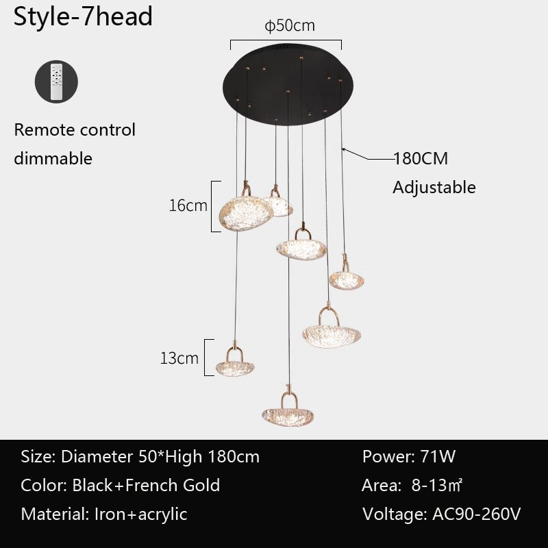 A 3-headed pendant light with remote control, black and gold colors, iron and acrylic materials, and adjustable height.