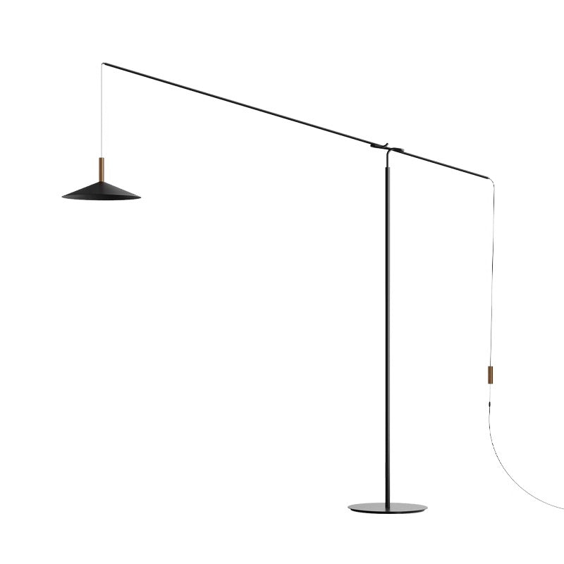 The Velluto Floor Lamp features minimalist design with a sleek horizontal arm, conical shade, and circular base. It offers adjustable lighting in an elegant black and brass color scheme.