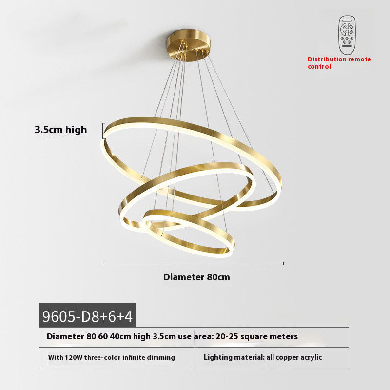 Elegant pendant light composed of gold rings, offering a modern flair to contemporary interior decor.