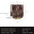 The Vintage brass glass table lamp blends modern and vintage styles with its gradient glass panels on a square base. It measures 19cm in diameter, 23cm high, and uses an E14 bulb to efficiently illuminate 1-3 square meters.