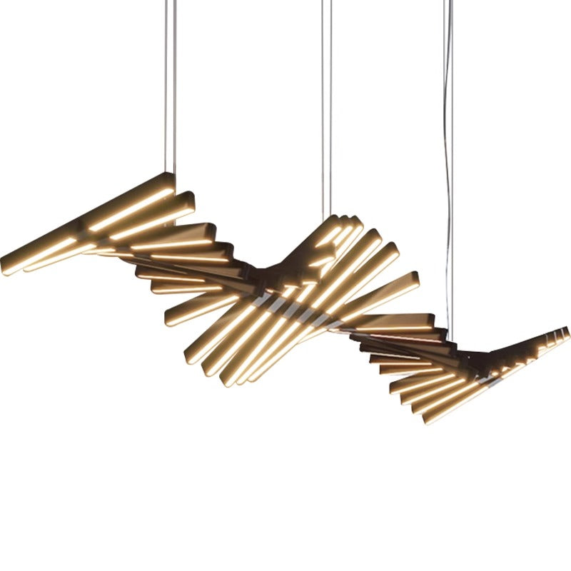 The Fishbone Wave Chandelier features an abstract, spiral design with cylindrical elements emitting a warm glow. Suspended by thin cables, its twisting pattern allows customizable lighting to match any ambiance.