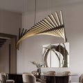 In a modern dining room, the Fishbone Wave Chandelier serves as an elegant centerpiece with adjustable lighting. A dark wooden table surrounded by beige chairs sits below, and a contemporary abstract painting enhances the wall.