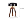 The Tripod Floor Lamp is a modern piece with a black dome-shaped wood metal shade and wooden tripod base, standing 520mm tall with a 350mm diameter. Its minimalist design features an LED bulb and cable extending from the base.