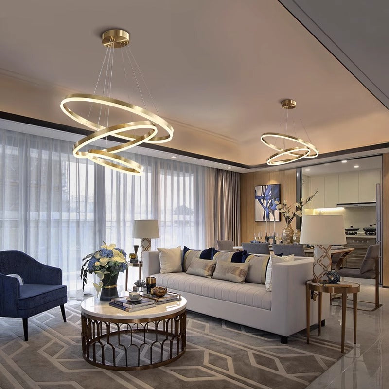 Modern chandelier design with two circular rings gracefully hanging from the ceiling, enhancing the room's ambiance.