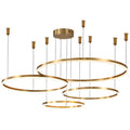 Modern gold pendant light with three circular rings suspended at different heights.