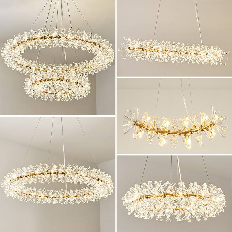 The Crystal Branch Chandelier collection features ring-shaped designs with crystal details and energy-efficient G4 LED bulbs, offering both layered and single-ring variations with adjustable hanging wires, elegantly suspended against a neutral background.